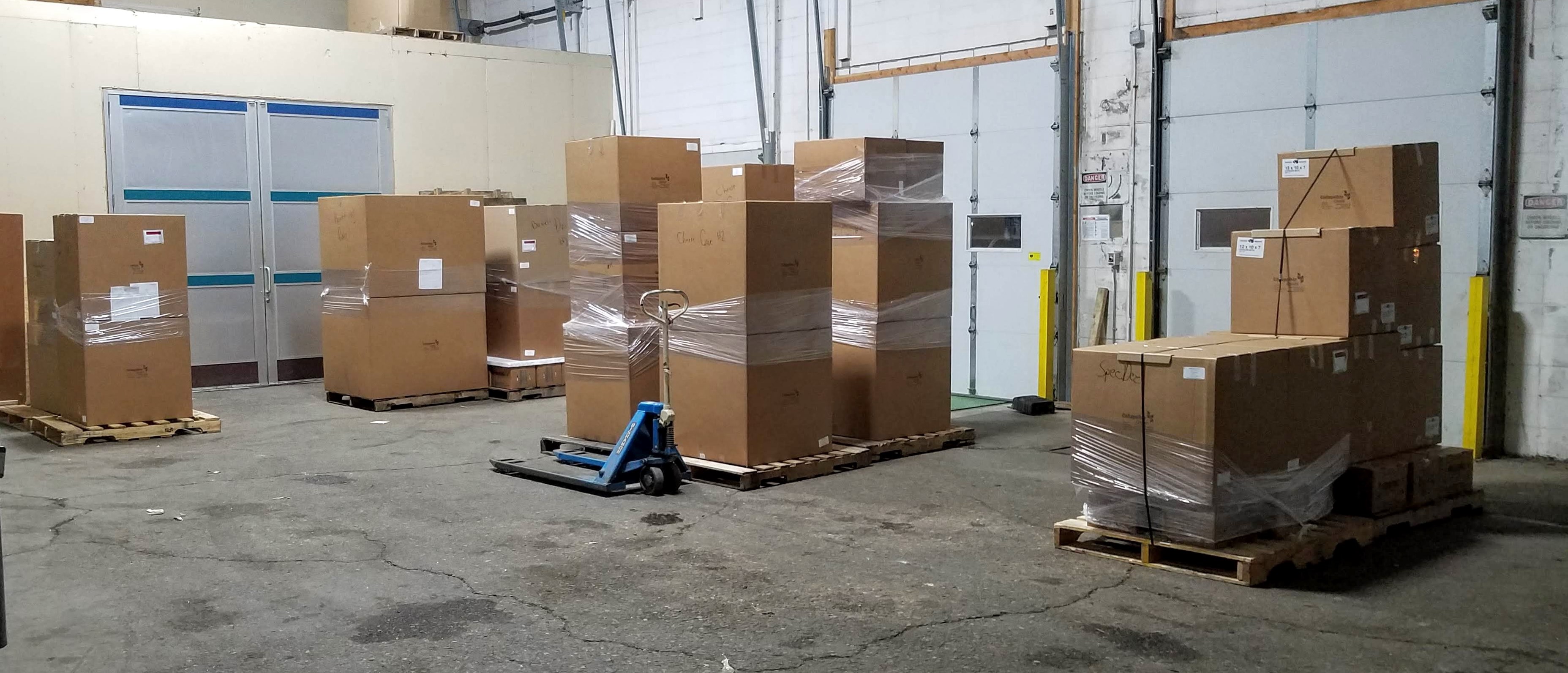 Several hundred collapsible coolers  and dozens of gel packs on nine pallets, ready for shipping to customers. Try getting that small footprint with formed coolers!